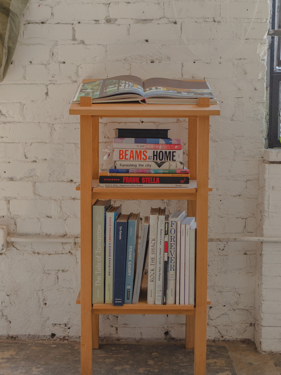 Our wood lectern with various art books on it.