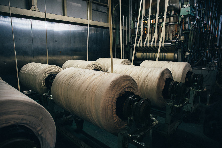 Each roll has one continuous rope of warp threads wrapped all the way around.